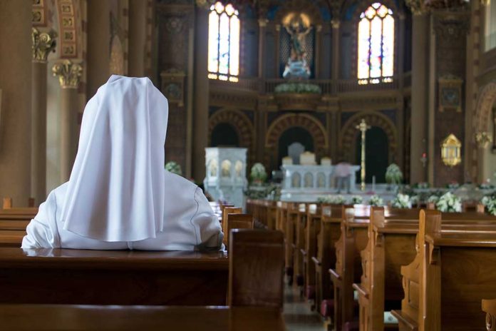 The,Nun,Sits,In,The,Church,And,Prays,To,God.