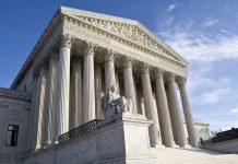 Supreme Court building with statue and columns