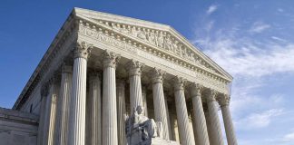 Supreme Court building with statue and columns