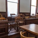 Empty jury box and table in courtroom