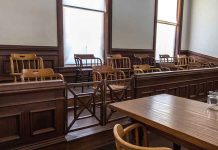 Empty jury box and table in courtroom