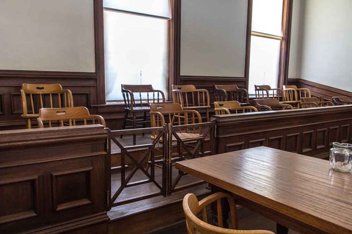 Empty jury box and table in courtroom