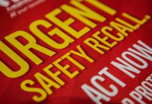 "Urgent safety recall sign in bold letters."