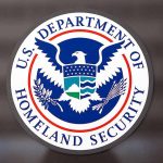 U.S. Department of Homeland Security logo on dark background.