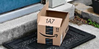 Open Amazon package on doorstep doormat.