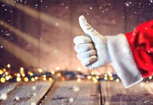 Santa hand giving thumbs up Christmas lights