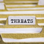 File tab labeled "Threats" in focus.