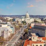 Washington, D.C. skyline with Capitol Building in background.