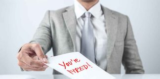 Person handing a paper with "You're Fired!" text.