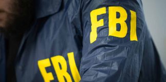 FBI agent wearing a jacket with yellow letters.