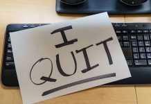 Paper with "I QUIT" on keyboard.