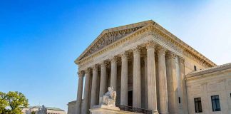 United States Supreme Court building with blue sky