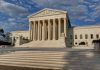 Supreme Court building with steps and columns.