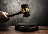 Judges gavel hitting a sound block