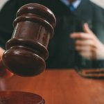 Judge with gavel making a decision in court