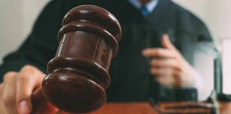 Judge with gavel making a decision in court
