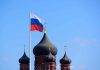 Russian flag next to church domes