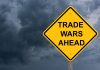 Yellow warning sign reads Trade Wars Ahead