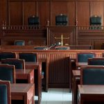 Empty courtroom with wooden furnishings and judge s bench