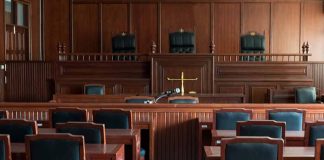 Empty courtroom with wooden furnishings and judge s bench
