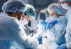 Doctors performing surgery in an operating room