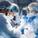 Doctors performing surgery in an operating room