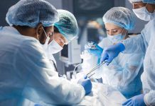 Doctors performing surgery in an operating room