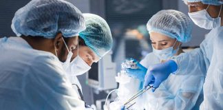 Doctors performing surgery in an operating room