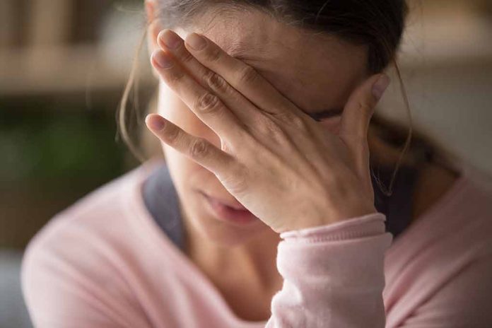 152332200 featured image Woman covering face with hand looking stressed