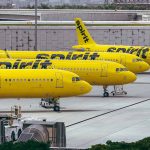 Yellow airplanes parked on the airport tarmac