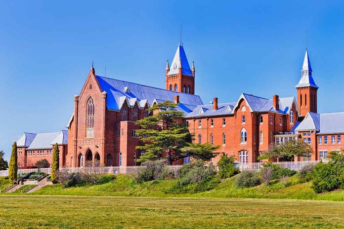 1844987860 featured image Large red brick building with turrets and green lawn