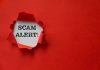Red paper tear with the words scam alert