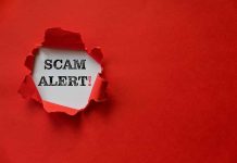 Red paper tear with the words scam alert
