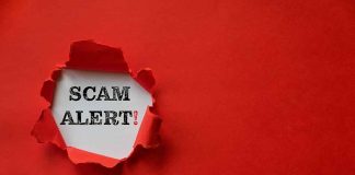 Red paper tear with the words scam alert
