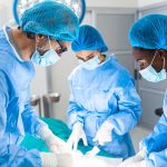 Surgeons performing an operation in a sterile environment