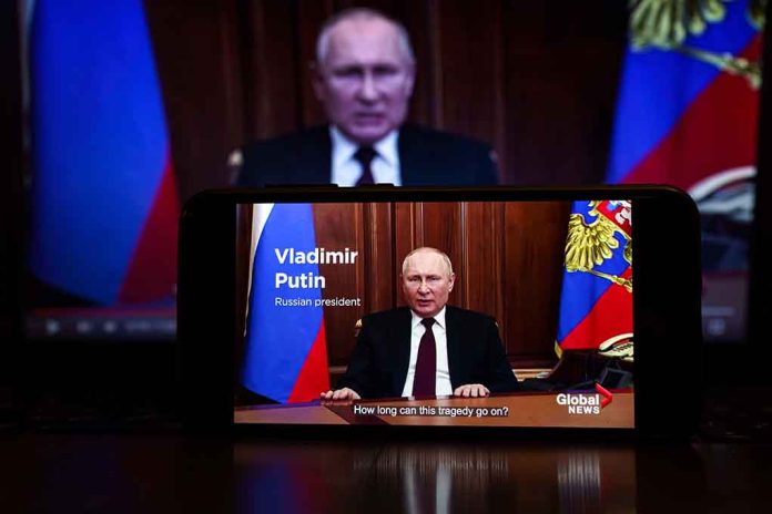 2127643805 featured image Man speaking on screen with Russian flag background