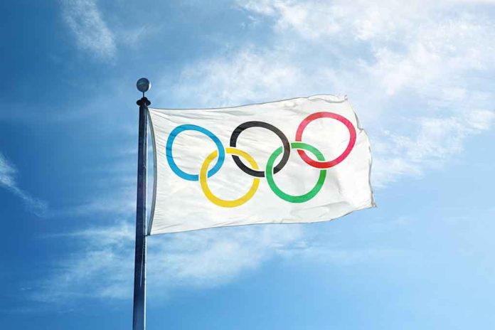 328195181 featured image Olympic flag waving against a blue sky