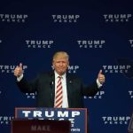 Man giving thumbs up at Trump Pence rally