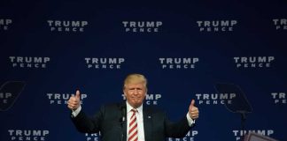 Man giving thumbs up at Trump Pence rally
