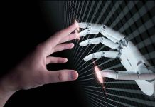 Human and robotic hand reaching out to touch