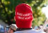 Red Make America Great Again hat on person's head