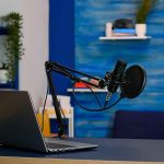 Laptop and a microphone on a desk
