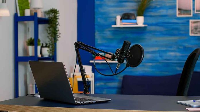 1939096570 featured image Laptop and a microphone on a desk