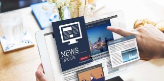 Person reading digital news on a tablet device