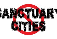 Text reading Sanctuary Cities crossed out in red