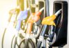 Colorful gas pump nozzles at a station