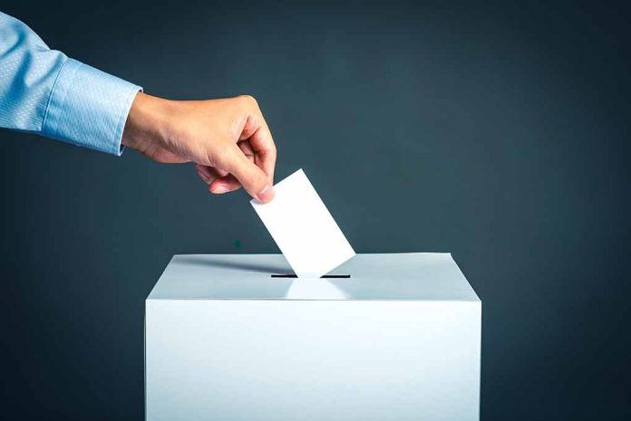 764908306 featured image Hand placing ballot into voting box