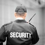Security guard holding a walkie-talkie