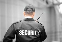Security guard holding a walkie-talkie