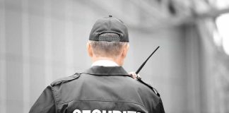 Security guard holding a walkie-talkie
